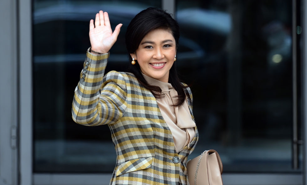 Thai Prime Minister Yingluck Shinawatra waves as she arrives to attend the Asia-Pacific Economic Cooperation (APEC) summit in Vladivostok, Russia on Sept. 8, 2012. (Saeed Khan/AFP/GettyImages)