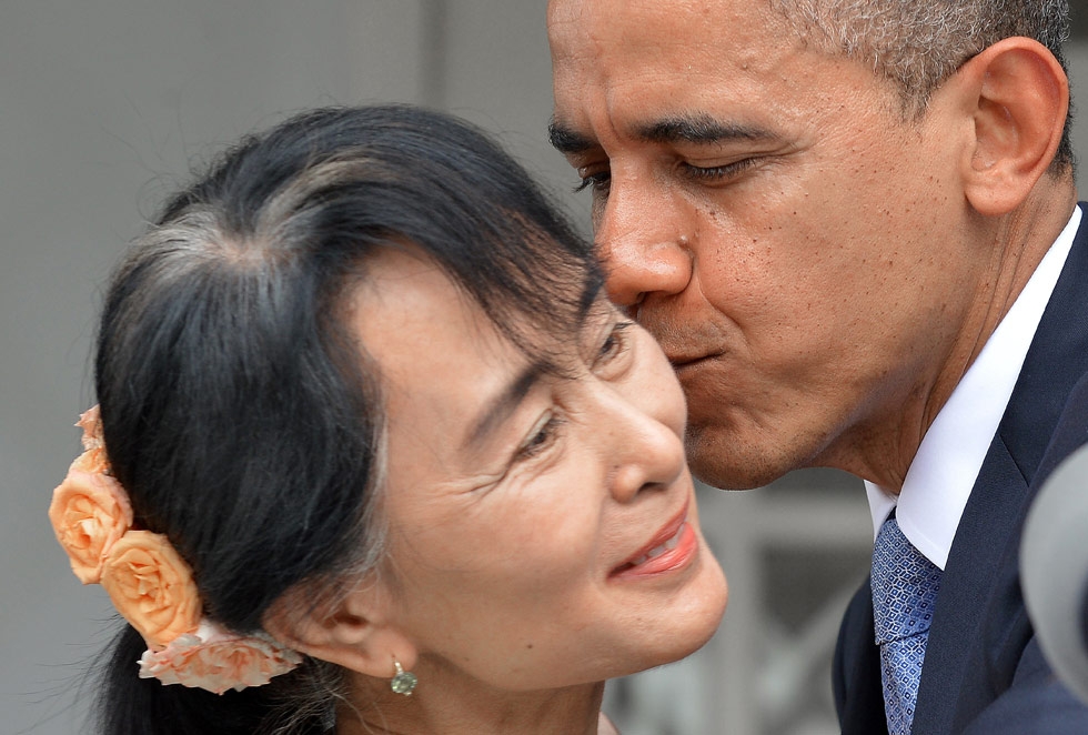 During his trip to Asia, President Barack Obama became the first U.S. president to visit Myanmar. He kissed opposition leader Aung San Suu Kyi at her residence in Yangon on November 19, 2012. (Jewel Samad/AFP/Getty Images)