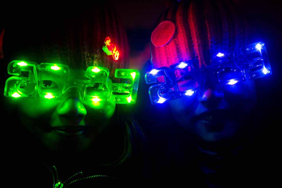 Revelers wear "2013" glasses as they celebrate the new year in Beijing, China on December 31, 2012. (Ed Jones/AFP/Getty Images)