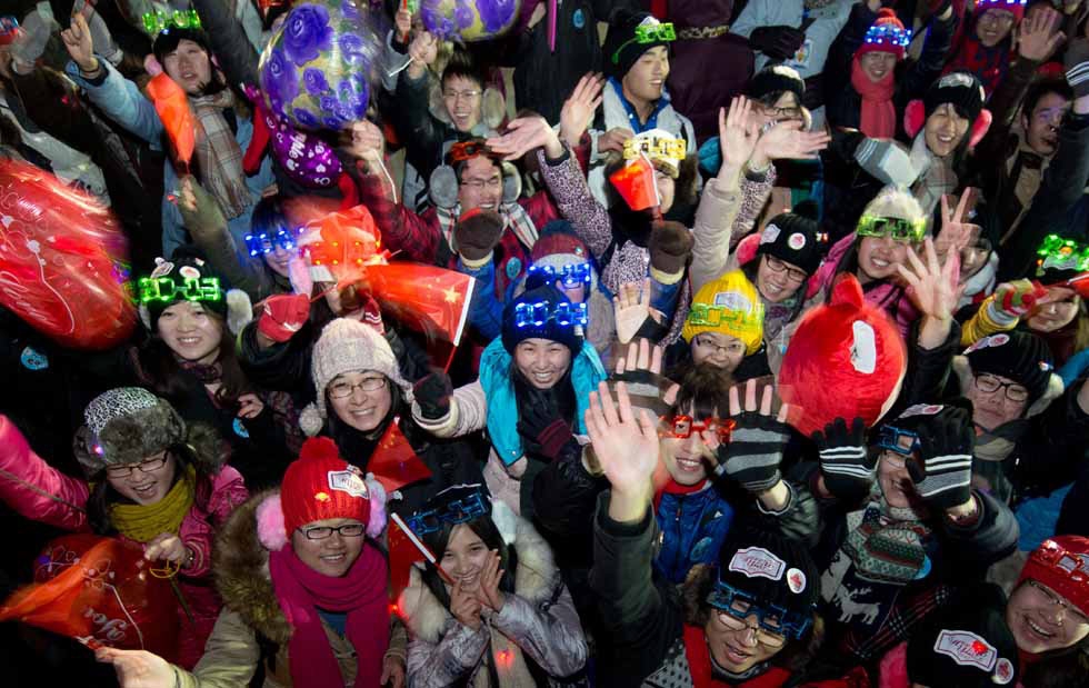Revelers celebrate the new year following a countdown event at the Summer Palace in Beijing, China on January 1, 2013. (Ed Jones/AFP/Getty Images)