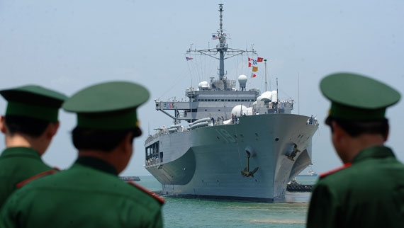 Vietnamese border guards watch the U.S. 7th Fleet's U.S.S. Blue Ridge entering Tien Sa port in Danang on April 23, 2012, ahead of five days of joint naval exercises between the U.S. and Vietnam. (Hoang Dinh Nam/AFP/GettyImages) 