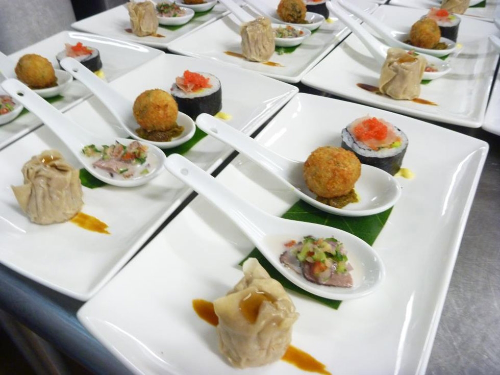 Fijian Assiette plate of chicken and ginger sui mai, smoked duck in coconut salsa, Moca spinach and  mascarpone arancini and California roll with seaweed caviar. (lanceseeto.com)