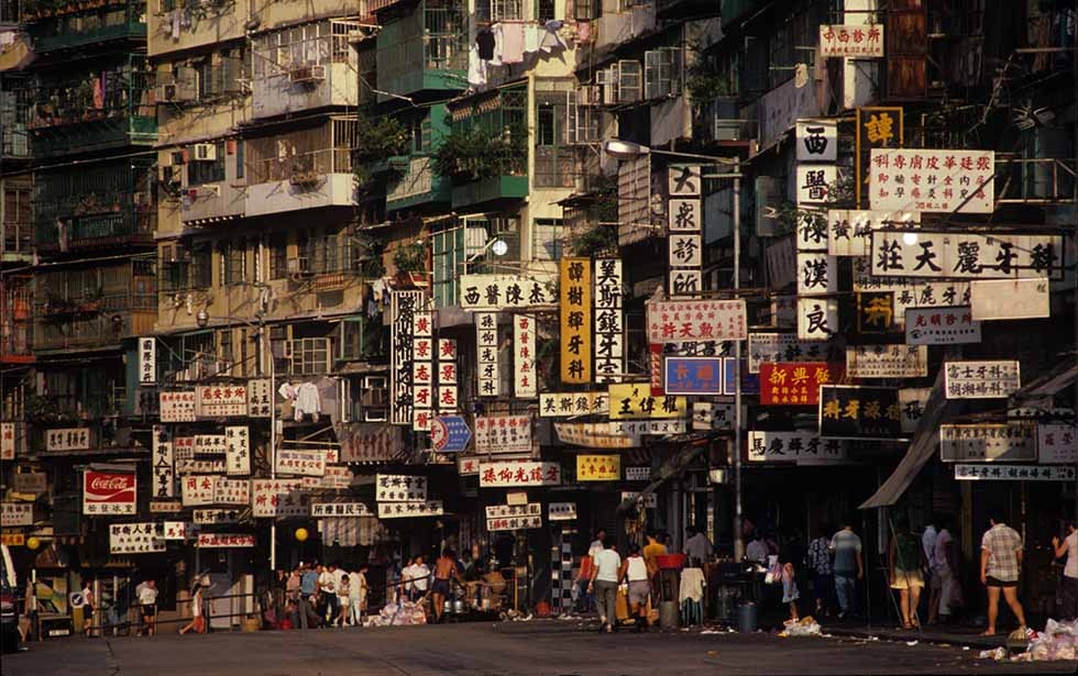 Street life was often bustling outside the Kowloon Walled City. Today, traces of the Walled City's characters remain in the surrounding neighborhoods, said Girard. (Greg Girard)