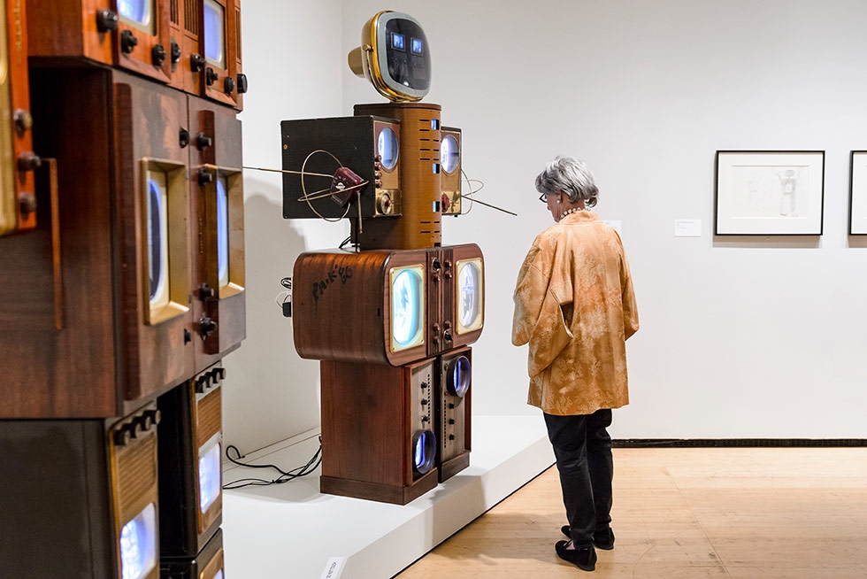 An Asia Society Museum goer takes in 'Nam June Paik: Becoming Robot,' on view through January 4, 2015. (C. Bay Milin/Asia Society)