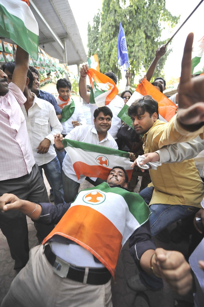 People celebrate during election day in Mumbai. (Tom Carter)