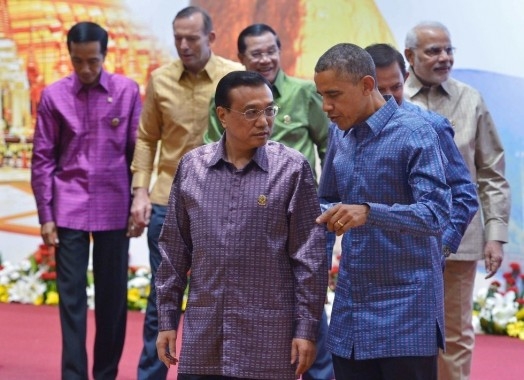 U.S. President Barack Obama walks with China's Premier Li Keqiang after posing for the East Asian Summit family photo at the Myanmar International Convention Center in Naypyidaw on November 12, 2014. (Mandel Ngan/Getty Images)