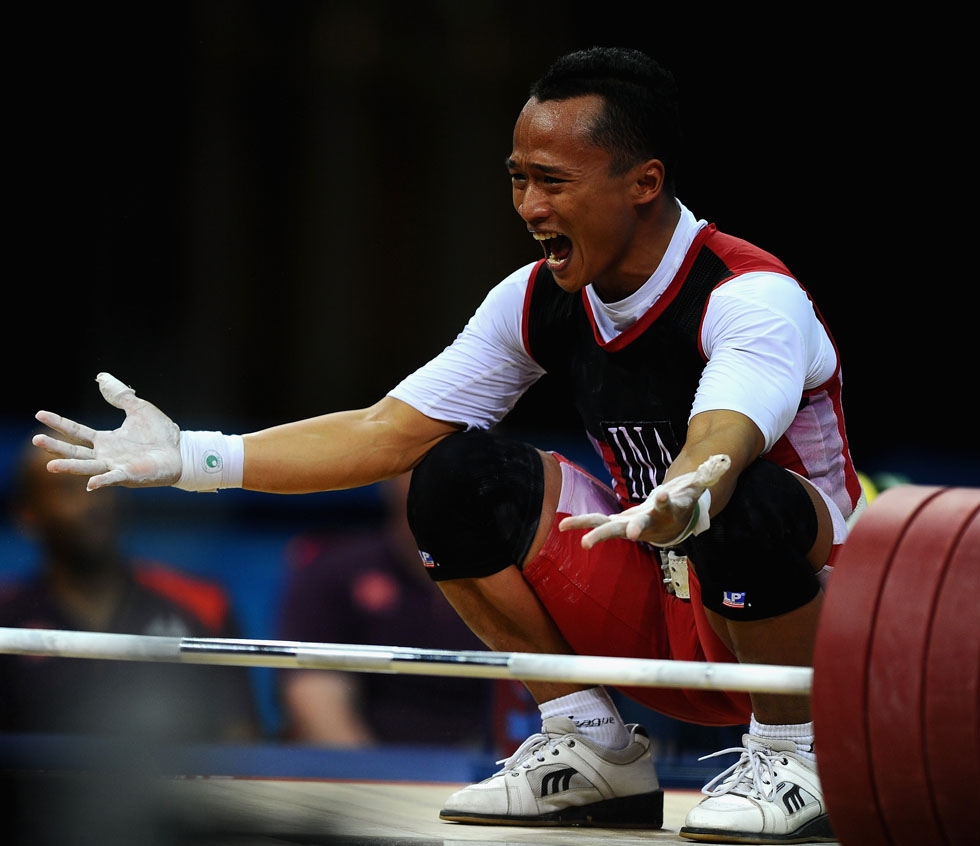 SILVER: Indonesia's Triyatno Triyatno celebrates winning the silver medal during the Men's 69kg Weightlifting final on July 31, 2012. (Laurence Griffiths/Getty Images)