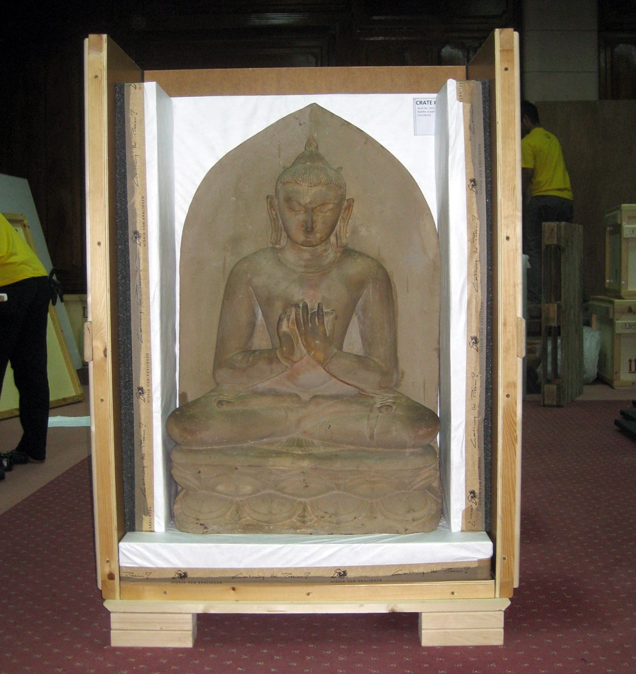 The Buddha is fitted into a custom crate for his trip to New York. (Clare McGowan/Asia Society)