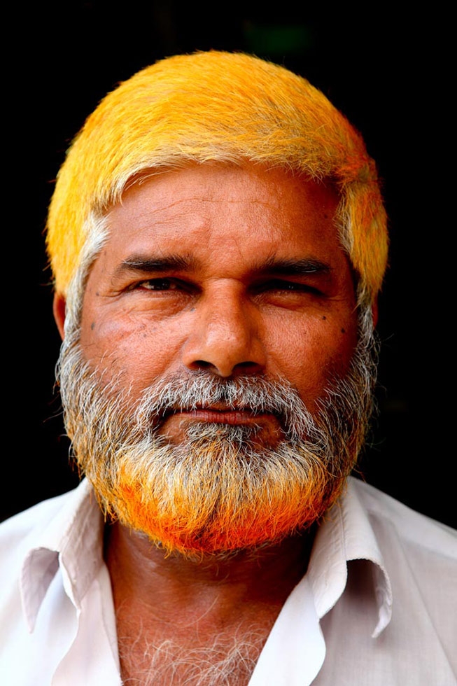 Abdul Mojid's henna dye cast a yellow tint on his hair. (GMB Akash)
