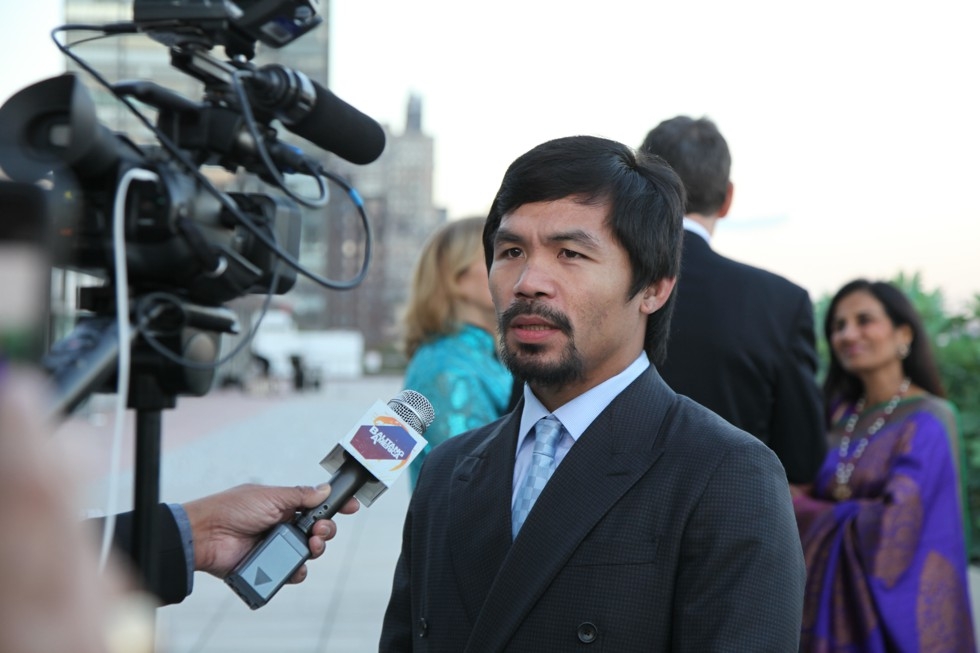 Boxer and Game Changer of the Year Manny Pacquiao is interviewed by a reporter at the Asia Game Changers award ceremony on October 13, 2015. (Ellen Wallop/Asia Society)
