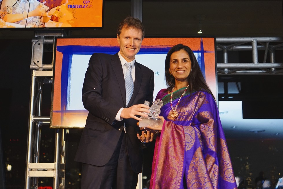 Asia Society Trustee Stephen Bird presents ICICI Bank CEO Chanda Kocchar with her Asia Game Changer award on October 13, 2015. (Jamie Watts/Asia Society)