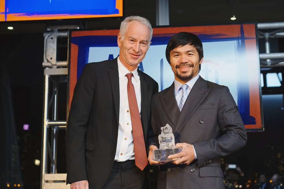 Tennis star John McEnroe poses with Asia Game Changer of the Year Manny Pacquiao on October 13, 2015. (Jamie Watts/Asia Society)