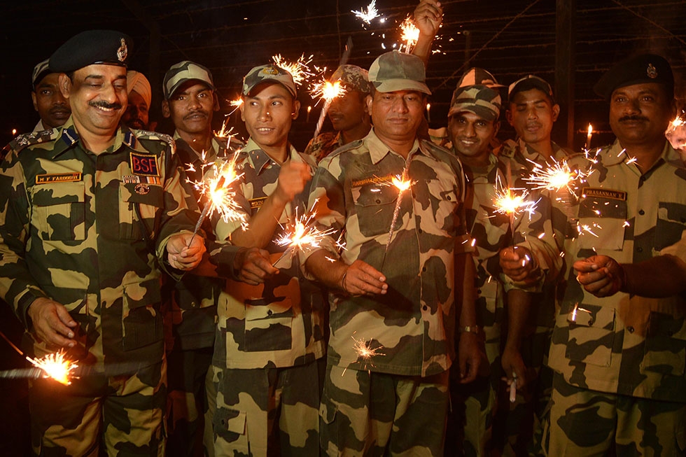 Indian Border Security Forces (BSF) play with sparklers to celebrate Diwali along the India-Pakistan Rajatal border post, about 45 kilometers from Amritsar, on October 23, 2014. (Narinder Nanu/AFP/Getty Images)