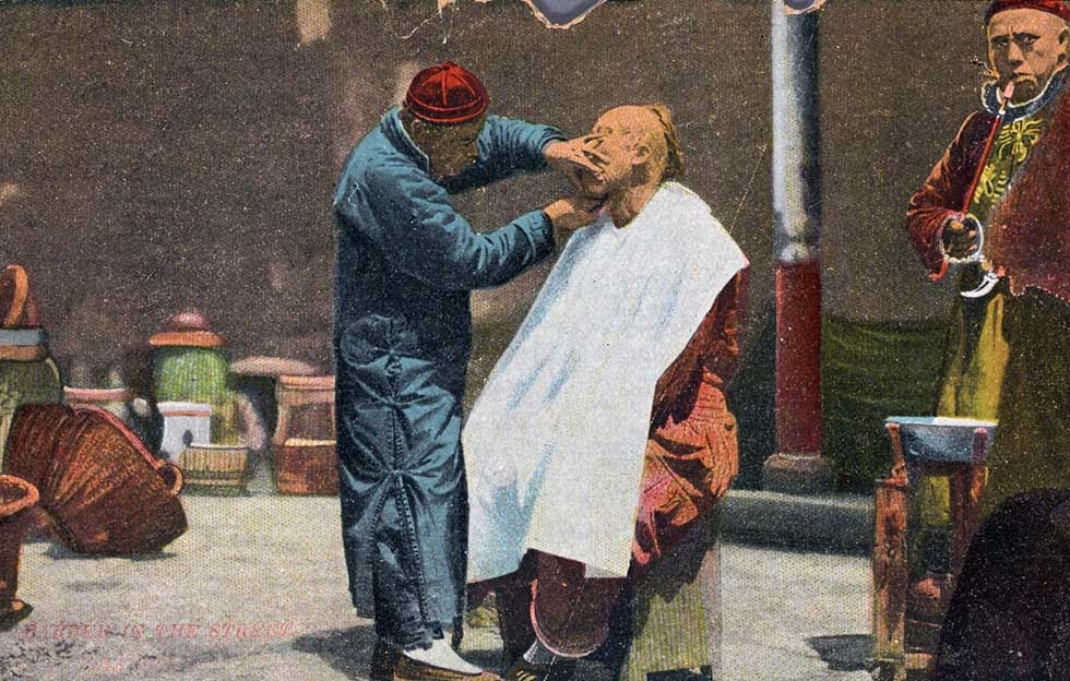 "Barber in the Street, Shanghai." 1907-1918. (Young Photo Co. Nanking Road Shanghai-printed in Germany/New York Public Library)
