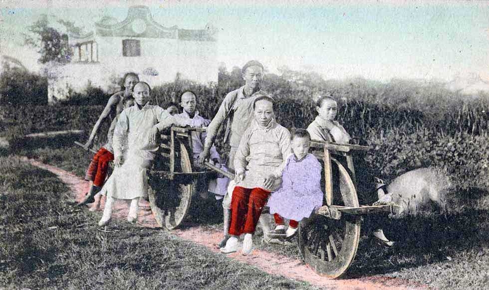 "Travelling on Wheel Barrow in Shanghai." 1921. (Kamogawa & Co. Shanghai/New York Public Library)