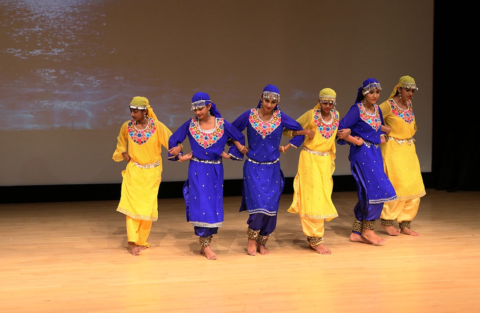 Celebrants are entertained and educated as performers teach the stories and mythology behind Indian folk dance in New York on October 15, 2016.  (Ellen Wallop/Asia Society)