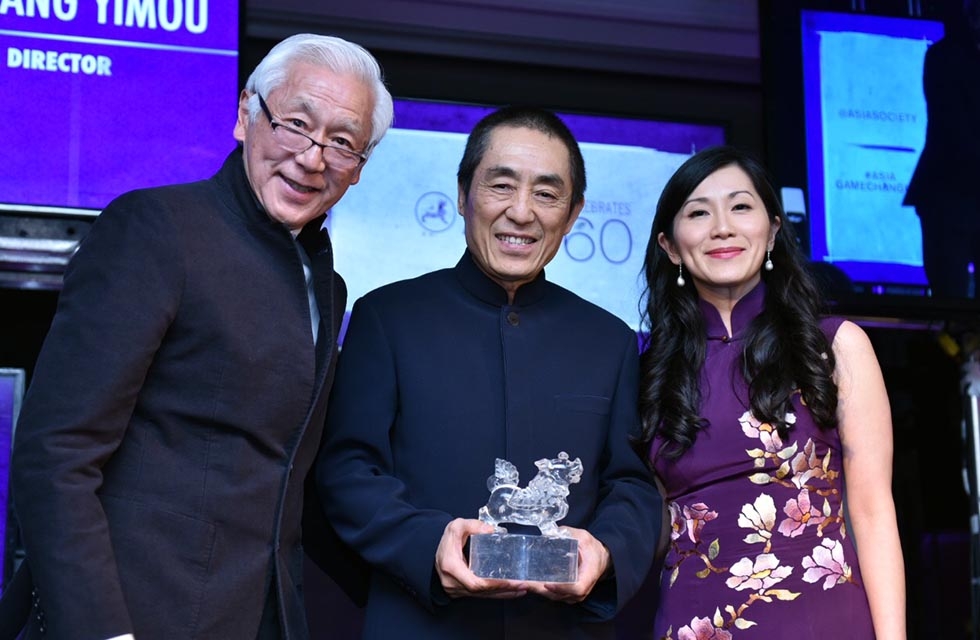 Oscar Tang (L), Zhang Yimou (C), and Agnes Hsu-Tang (R) with Zhang's Asia Game Changer Award at the United Nations on October 27, 2016. (Jamie Watts/Asia Society)