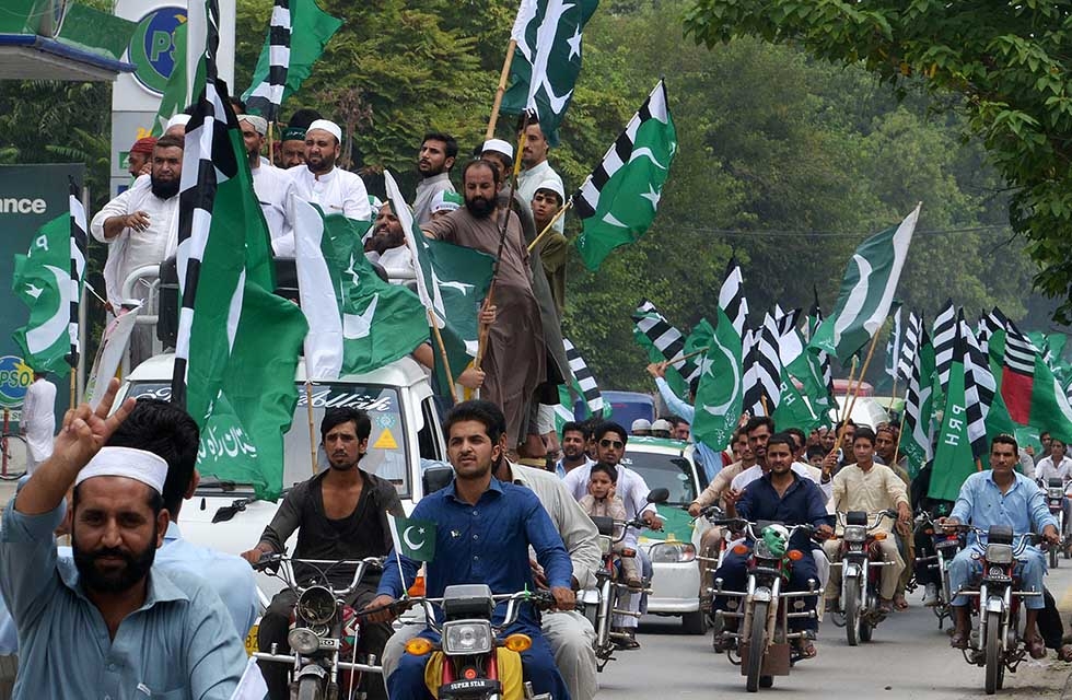 Pakistani residents march during a rally to mark the country's Independence Day in Peshawar on August 14, 2017. (Abdul Majeed/AFP/Getty)