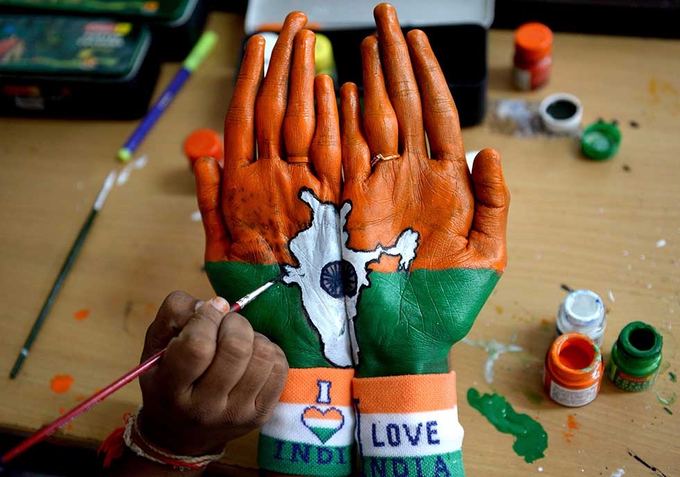 An Indian student gets their palm painted with the Indian national flag and country map at an event during Indian Independence Day celebrations in Chennai on August 15, 2017. (Arun Sankar/AFP/Getty)