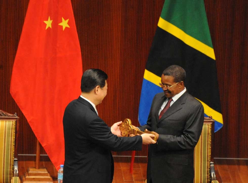 President Xi Jinping of The Peoples' Republic of China in a key-handing ceremony with Tanzania President Jakaya Kikwete on March 25, 2013. (John Lukuwi/AFP/Getty Images) 