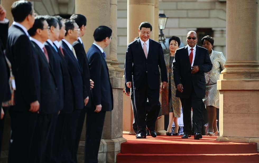 President of the Republic of South Africa Jacob Zuma (2nd R) receives Xi Jinping (L) and Peng Liyuan (C) for a state visit at the Union Buildings in Pretoria on March 26, 2013. (Stringer/AFP/Getty Images)
