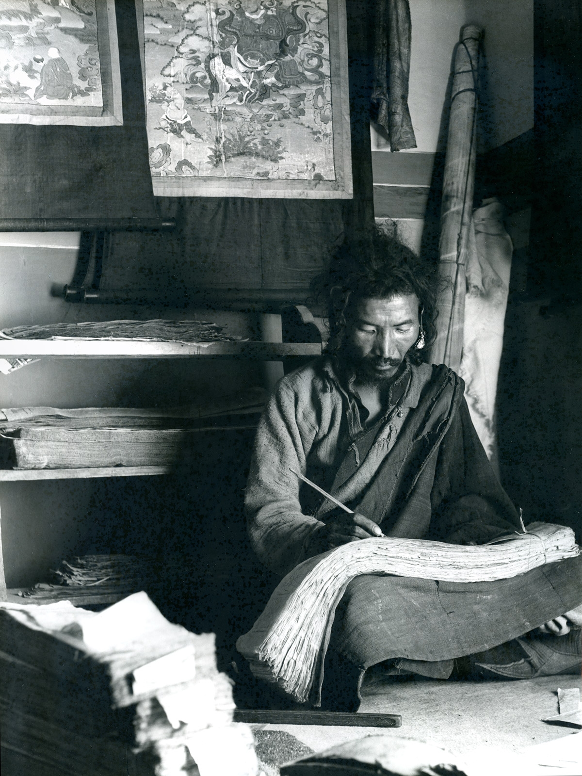 Scribe writing in Gyantse, Tsang, Tibet. (F. Maraini, 1937; 37/2434. Courtesy of the Museum of Civilisation-Museum of Oriental Art "Giuseppe Tucci," Rome.)