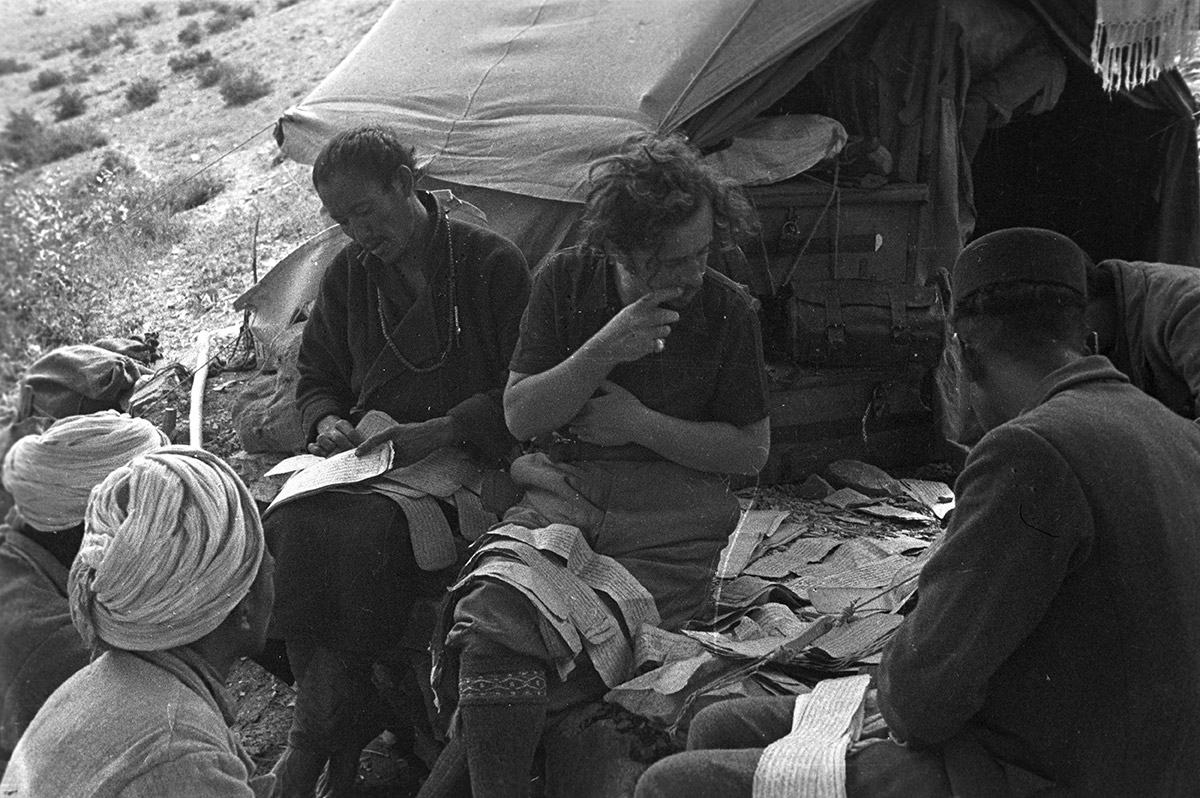 Giuseppe Tucci reorganizing the scattered pages of several manuscripts at his camp, Miang, Ngari, Tibet. (Eugenio Ghersi, 1933; Neg. dep. 6037/28. Courtesy of Istituto Italiano per l'Africa e l'Oriente (Is.I.A.O.) in l.c.a. and Ministero Degli Affari Esteri e della Cooperazione Internazionale.)