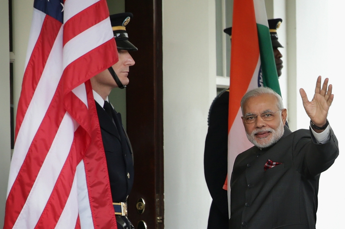 Indian Prime Minister Narendra Modi waves as he arrives outside the West Wing of the White House for an Oval Office meeting with U.S. President Barack Obama September 30, 2014.