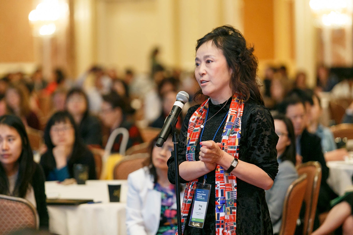 Ying Jin, the 2018 National Language Teacher of the Year named by ACTFL, asks a question during one of the plenary sessions at the 2018 National Chinese Language Conference