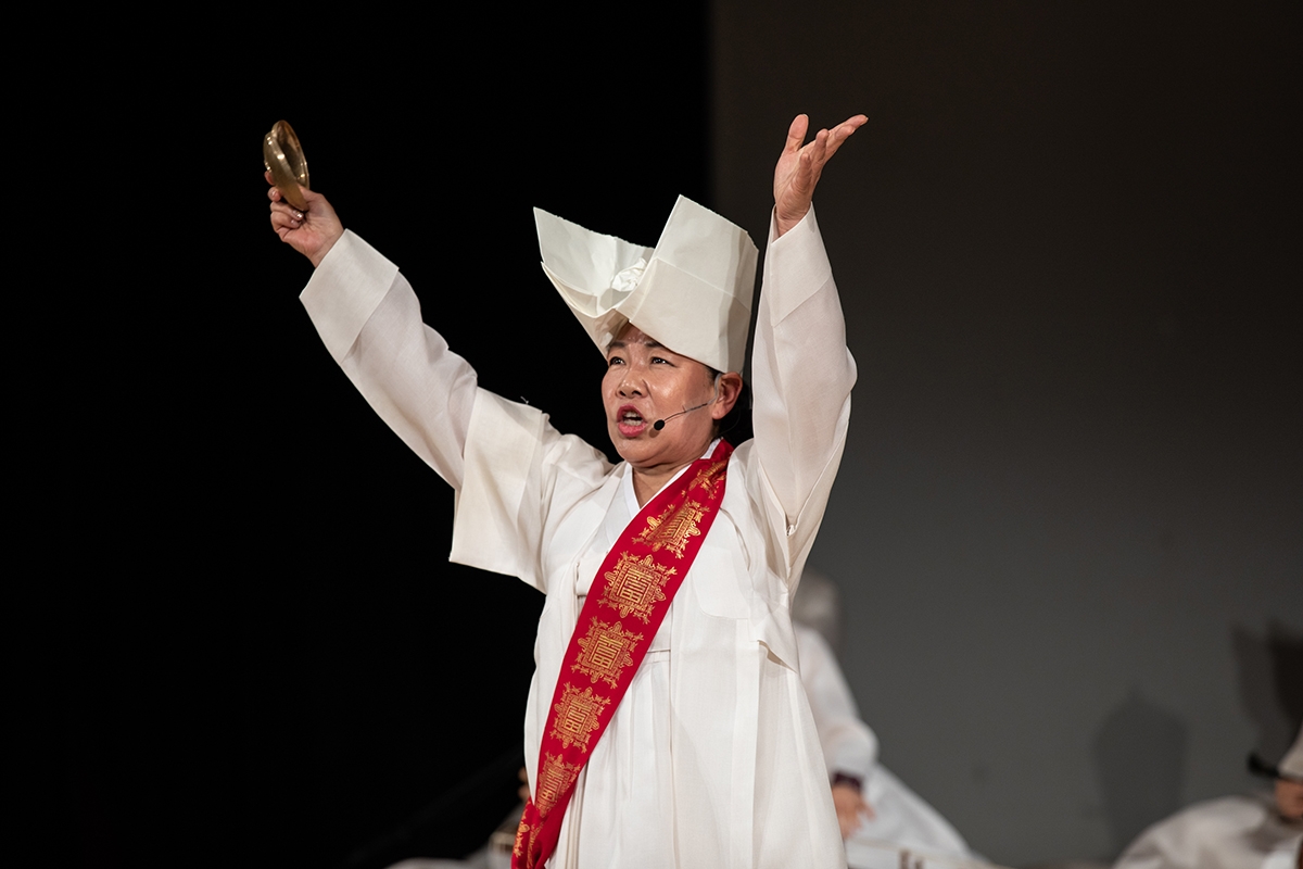 Shaman Park Miouk on stage during Ssitkimkut: The Korean Shaman Ritual of the Dead at Asia Society New York