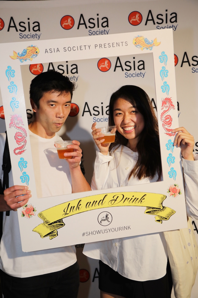 Guests at Asia Society's Ink and Drink party. Guests pose for a photo at the 'Ink and Drink' party at Asia Society New York, June 22, 2018. (Ellen Wallop/Asia Society)