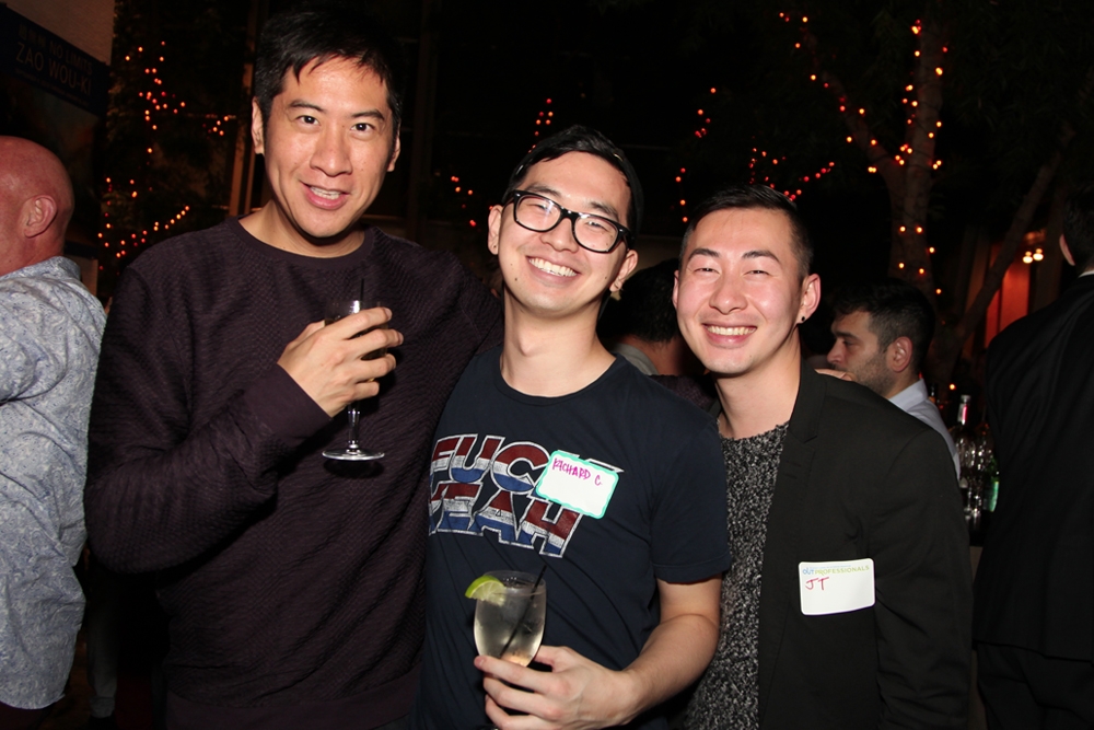 Friends smile for the camera at Asia Society's LGBT Connections Night. 