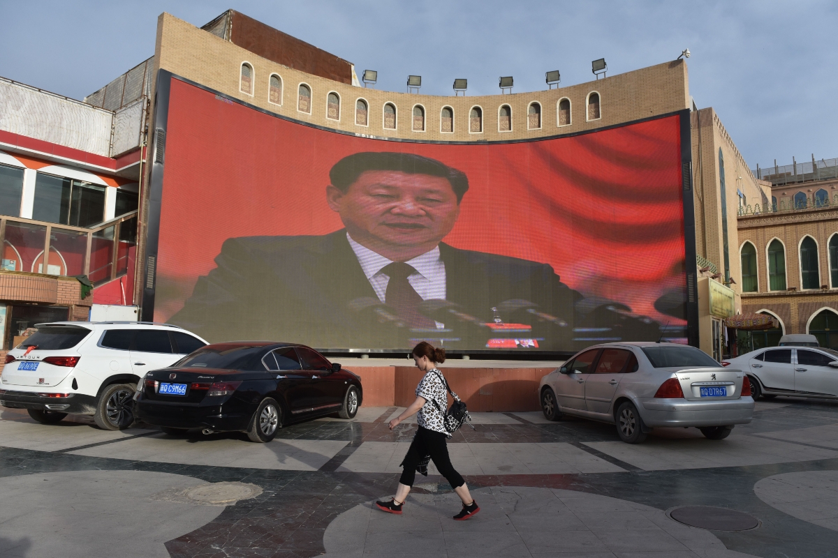A video billboard of Xi Jinping overlooks Kashgar, China