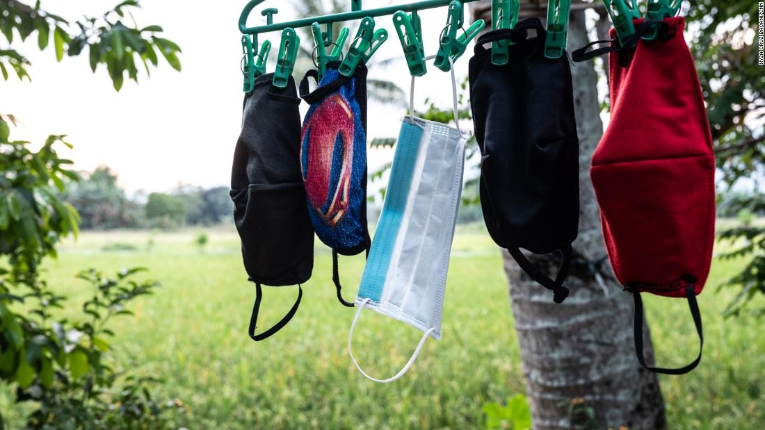 Nurse April Abrias' facemasks are hung out to dry after being washed so they can be reused