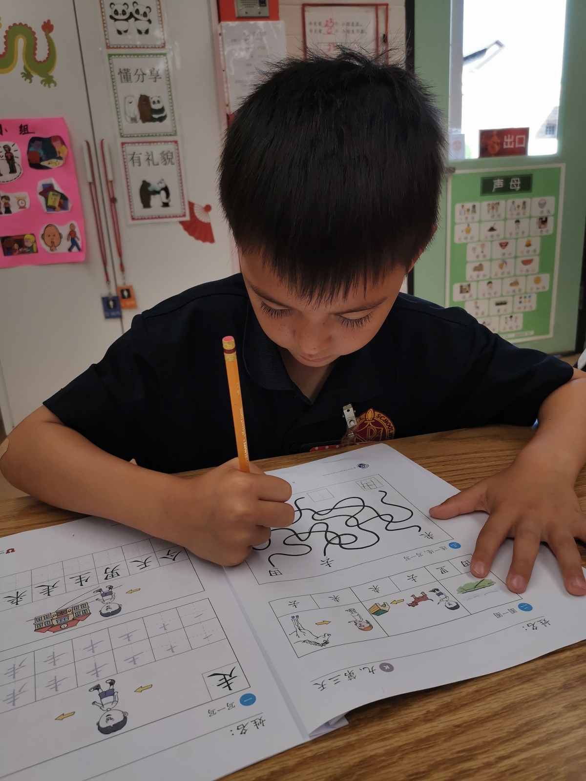 First-grader doing a Chinese worksheet