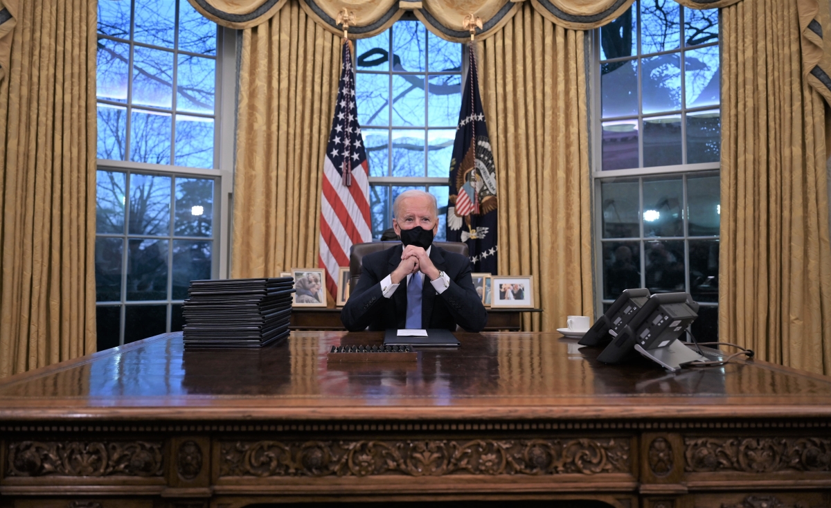 President Joe Biden sits in the Oval Office at the White House in January 2021