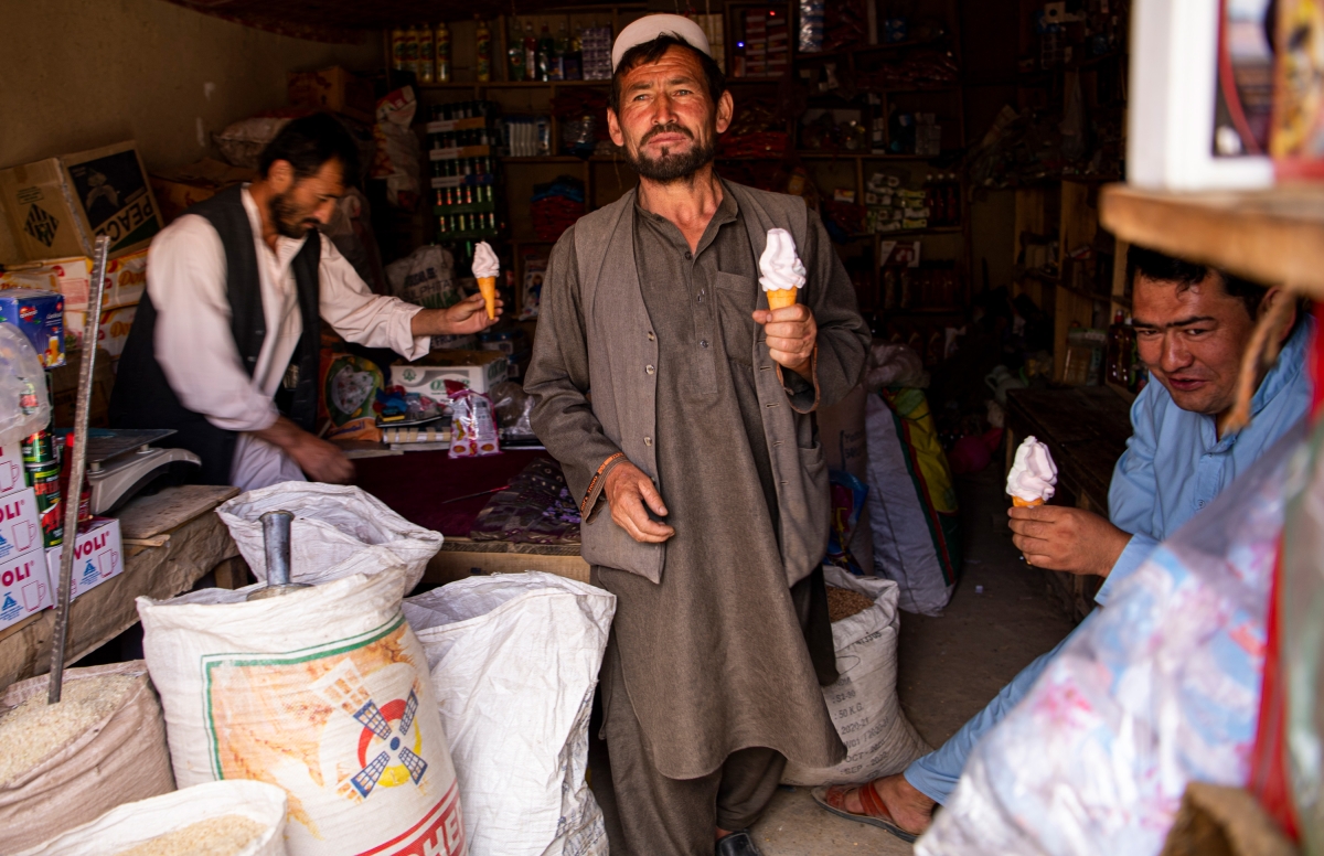 Men eat ice cream in a shop in Bamyan province’s Saighan district, located in Afghanistan’s central highlands, three days after the Taliban's retreat on July 21, 2021