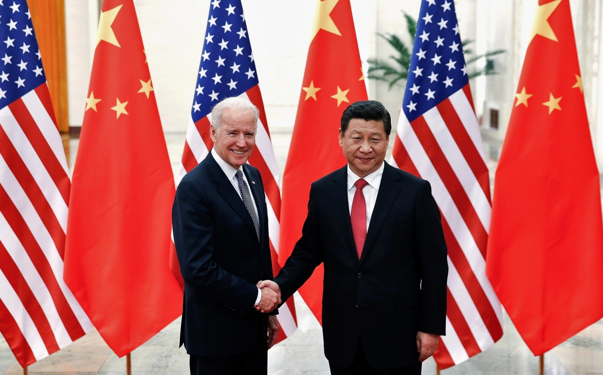 Chinese President Xi Jinping shakes hands with U.S. Vice President Joe Biden inside the Great Hall of the People in Beijing in 2013.