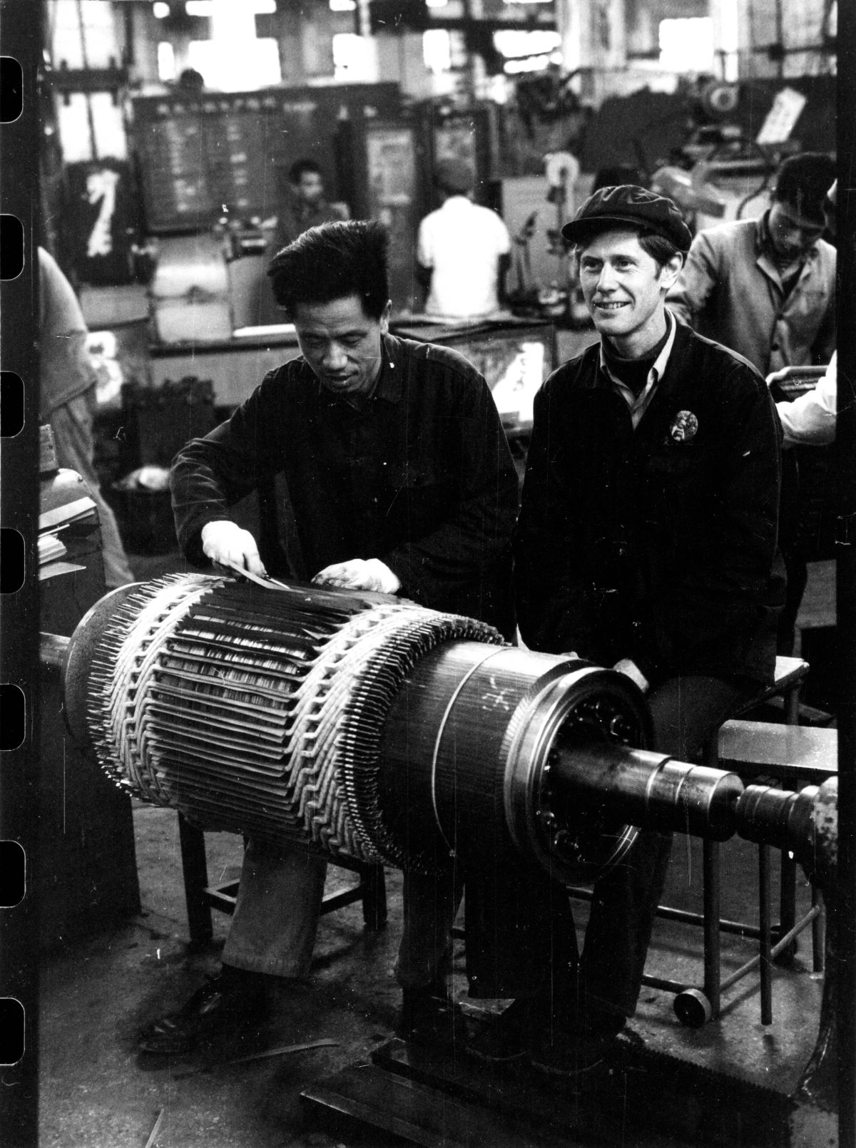 Orville Schell works at the Shanghai Electrical Machinery Factory while on assignment for The New Yorker in 1975.