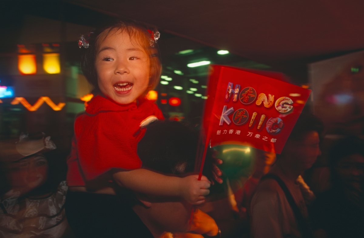 A young girl in Hong Kong celebrates the handover on June 30, 1997.
