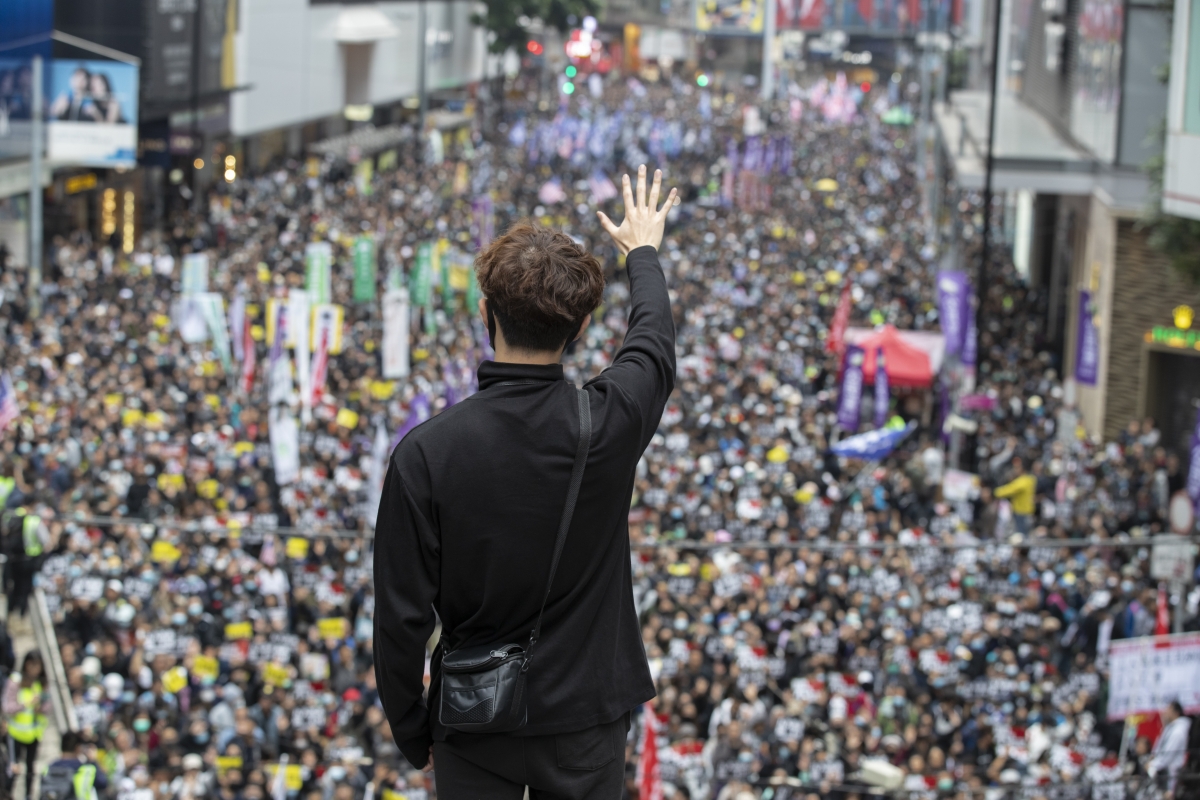 A protester flashes his hand at a demonstration in Hong Kong