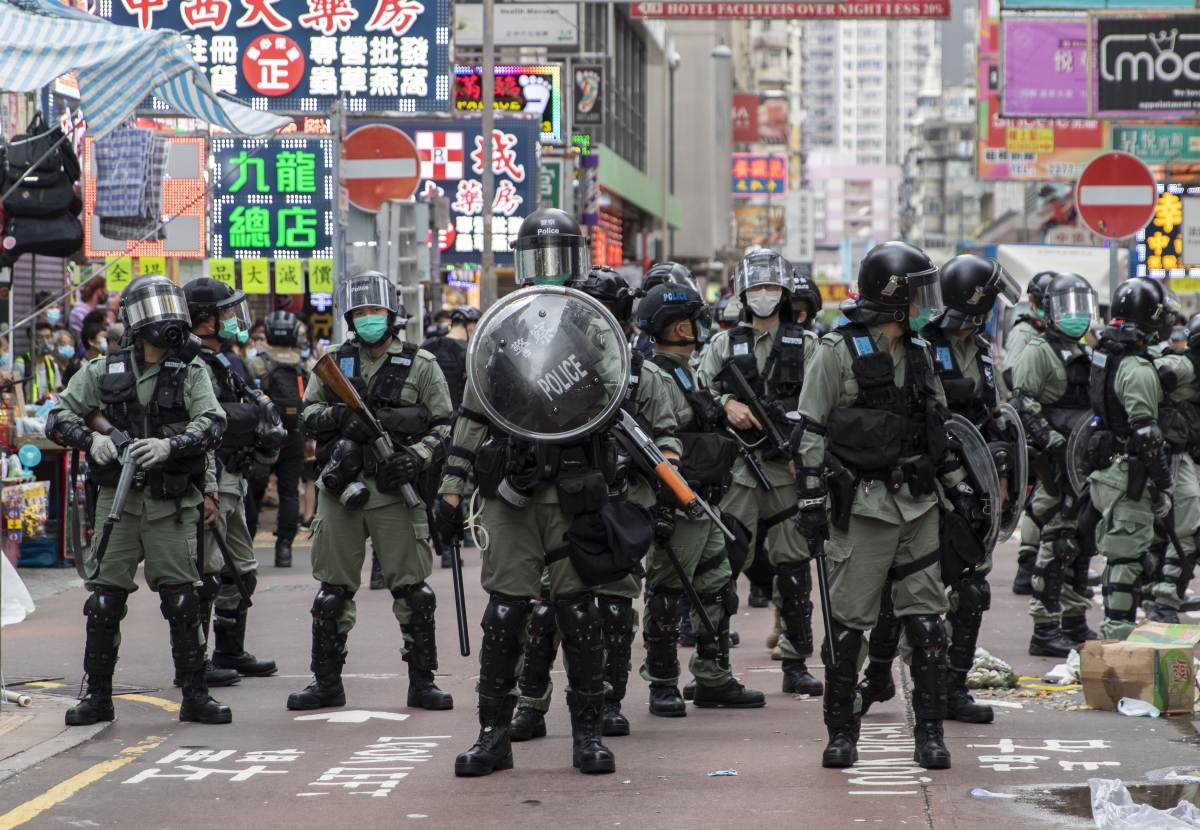 Police stand guard during a protest in Mongkok, Hong Kong