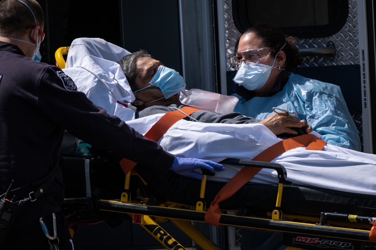A COVID-19 patient is moved from an ambulance to Wyckoff Heights Medical Center in Brooklyn on April 7, 2020. 