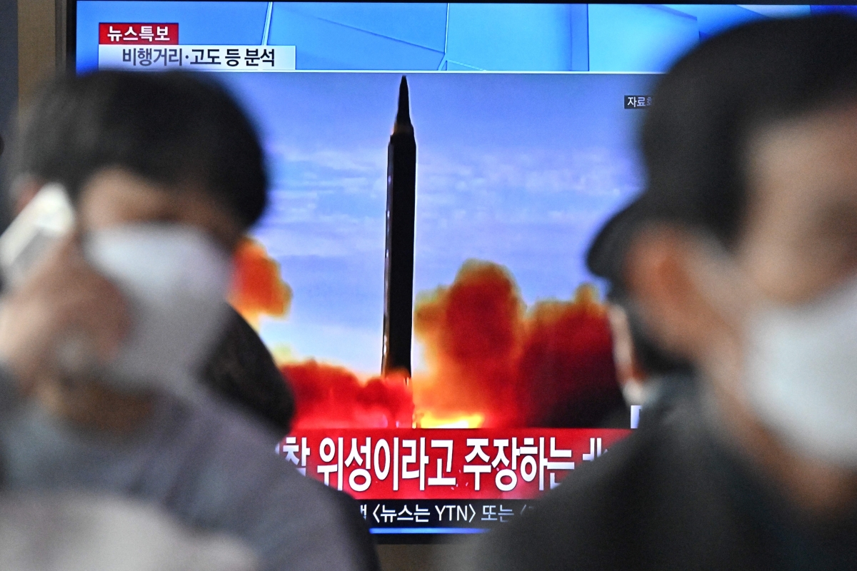 People watch a TV at the Seoul Railway Station showing a file image of a North Korean missile launch on March 24, 2022 in Seoul, South Korea. North Korea fired an intercontinental ballistic missile (ICBM) toward the East Sea on Thursday, South Korea's military said, a move sharply escalating tensions in the region.