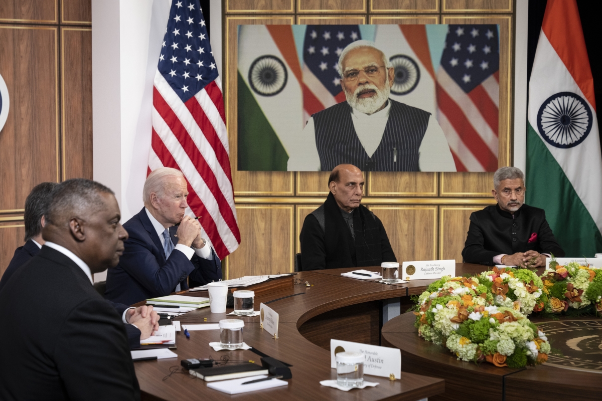 U.S. Defense Secretary Lloyd Austin, U.S. President Joe Biden, Indian Minister of Defense Rajnath Singh, and Indian Foreign Minister Subrahmanyam Jaishankar listen as Prime Minister of India Narendra Modi (on screen) speaks during a virtual meeting in the South Court Auditorium of the White House complex.
