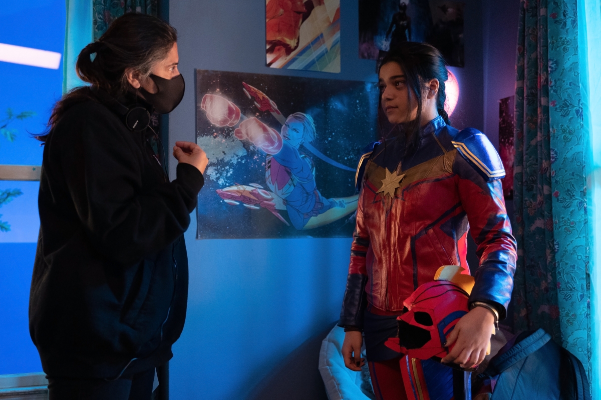 Director Sharmeen Obaid-Chinoy, left, goes over scenes with Iman Vellani as Ms. Marvel / Kamala Khan on the set of Marvel Studios’ Ms. Marvel.