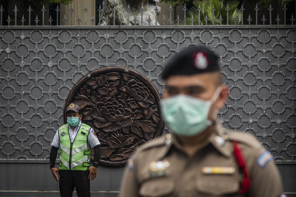 Thai police officers stand guard outside the Embassy of The People's Republic of China as protest leaders from the Thalufah pro-democracy protest group deliver a letter regarding locals' distrust of the Sinovac Vaccine on August 20, 2021 in Bangkok, Thailand.