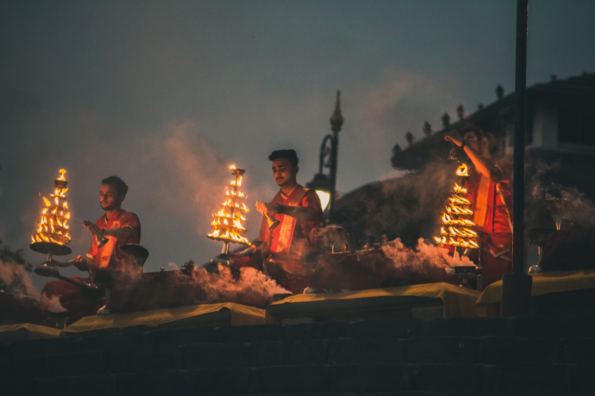 People lighting ceremonial fire