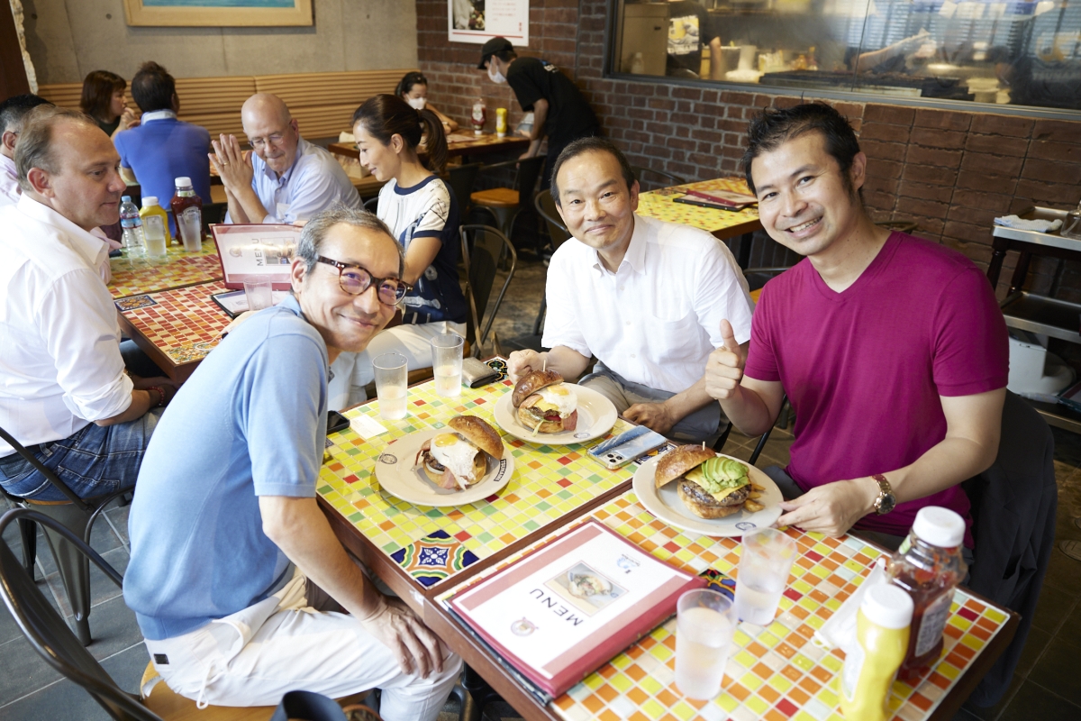 Founding Member from left, Mitsuru Igarashi, Masahiro Koshiba and Daisuke Kan with their Tsunami burgers!