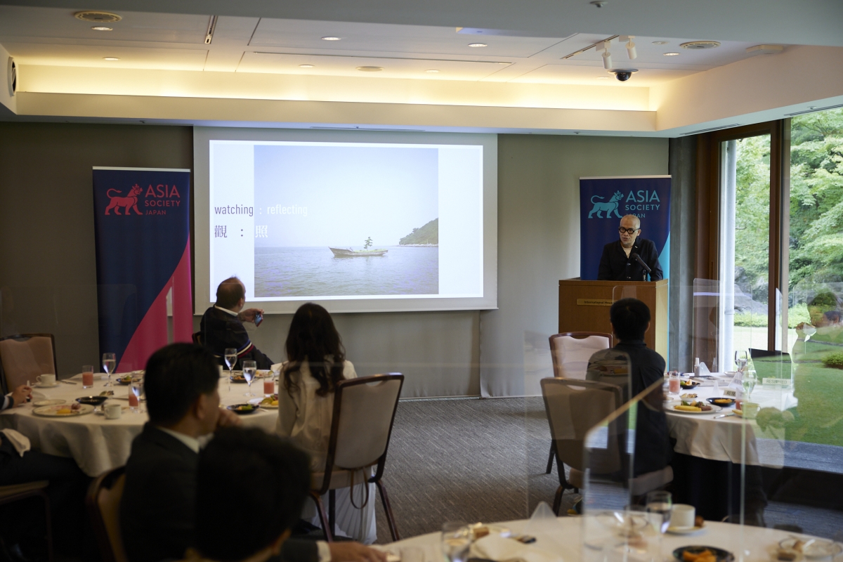 Overview of the venue looking from the back with screen on the left and Mr. Wong at the podium on the right.